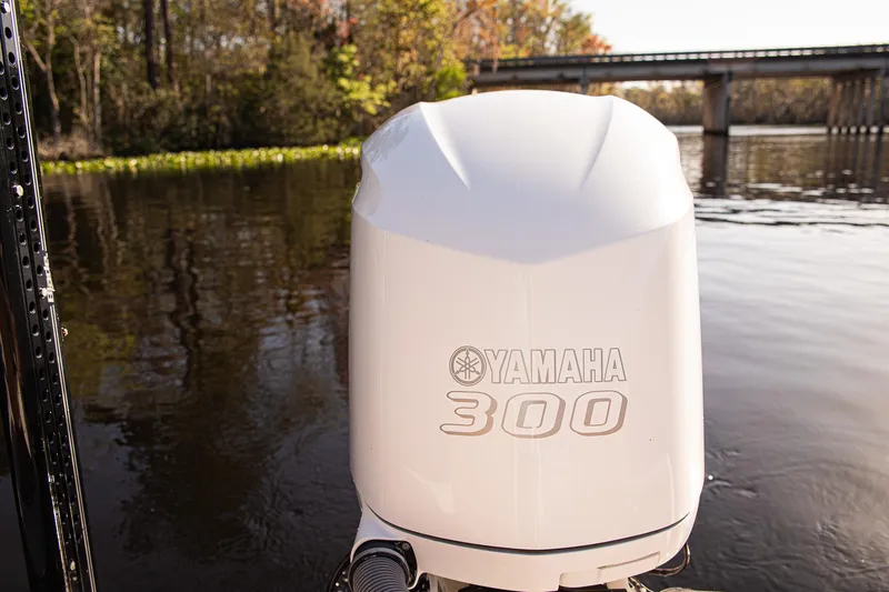 Slide: The Image of Yamaha 300 outboard motor on Everglades 253 Center Console, 2017, in a scenic river setting. - 36