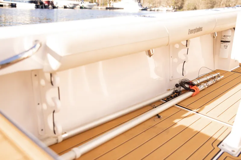 Slide: The Image of 2017 Everglades 253 Center Console boat interior with rod storage and teak flooring. - 40