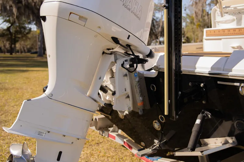 Slide: The Image of 2017 Everglades 253 Center Console boat with outboard motor on trailer. - 46