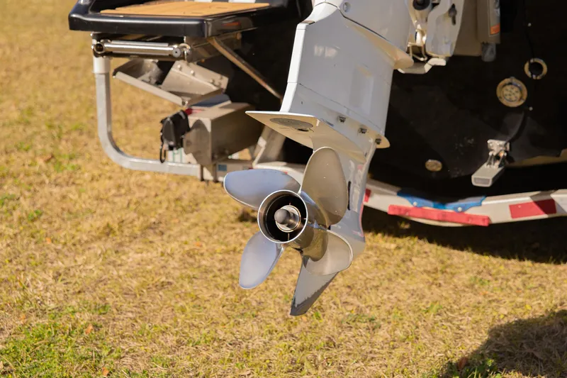 Slide: The Image of Close-up of Everglades 253 Center Console 2017 boat propeller on grass. - 47