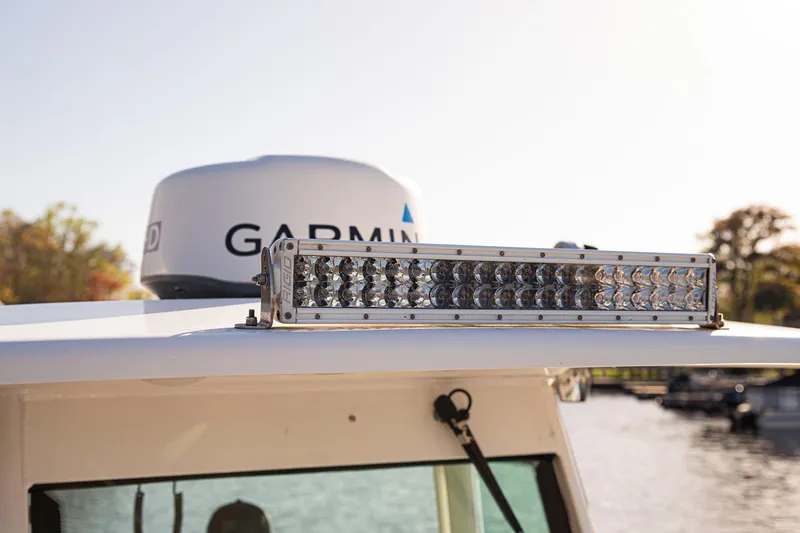 Slide: The Image of 2017 Everglades 253 Center Console with Garmin radar and LED light bar. - 48