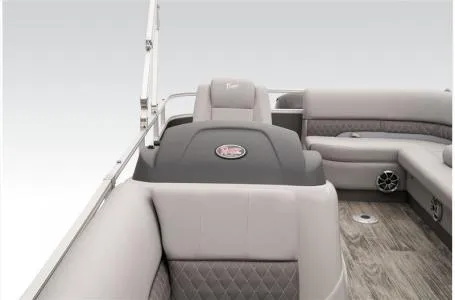 Slide: The Image of 2024 Ranger 223C boat interior with gray seating and wood-style flooring. - 17