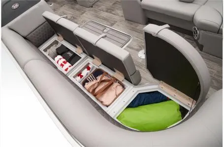 Slide: The Image of 2024 Ranger 223C boat interior storage compartments with various items, showcasing spacious seating and organization. - 8