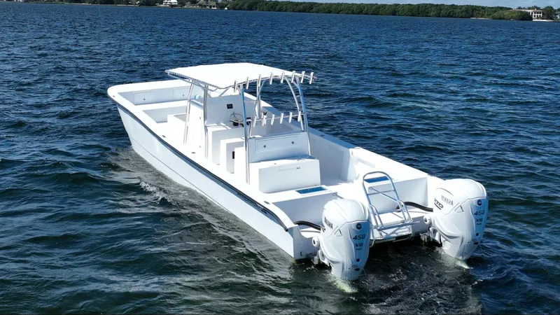 Slide: The Image of 2025 AmeraCat 395 boat cruising on open water, featuring dual outboard engines. - 1