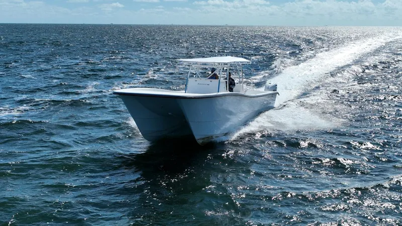 Slide: The Image of 2025 AmeraCat 395 boat cruising on open ocean waters. - 7