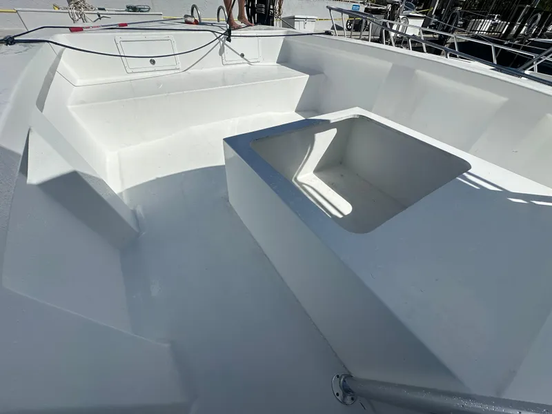 Slide: The Image of 2025 AmeraCat 395 boat interior with spacious seating and storage area. - 8