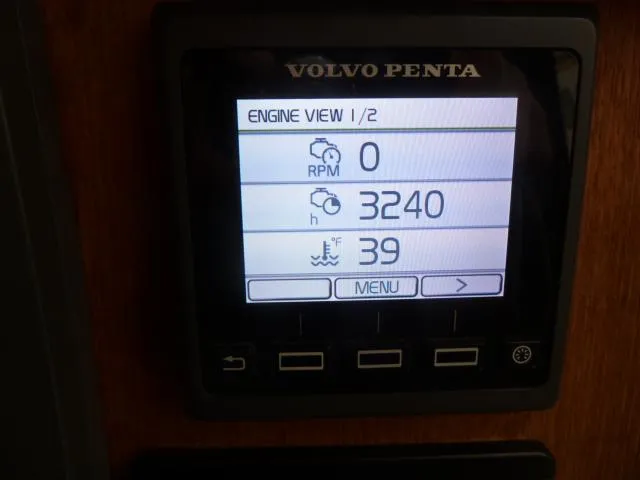 Slide: The Image of Volvo Penta engine display showing RPM, hours, and temperature on a 2013 Ranger Tugs R-31. - 12