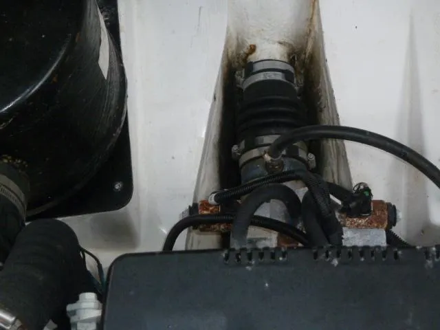Slide: The Image of Engine compartment of 2013 Ranger Tugs R-31, showing mechanical components and hoses. - 21