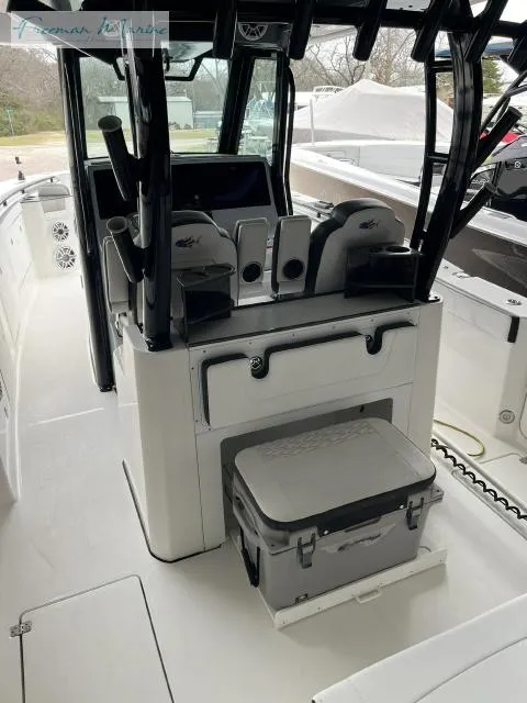 Slide: The Image of 2022 Crevalle 33 CSF boat interior with seating and storage. - 11