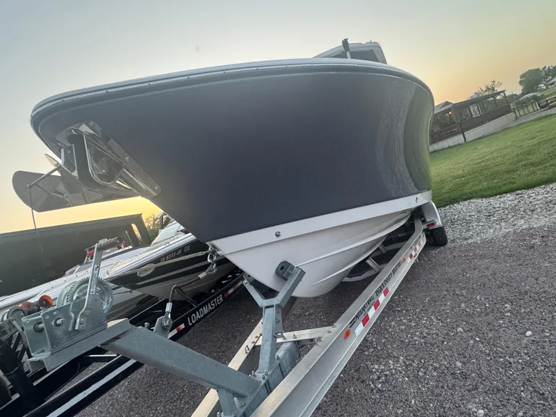 Slide: The Image of 2022 Crevalle 33 CSF boat on trailer at sunset, side view. - 3