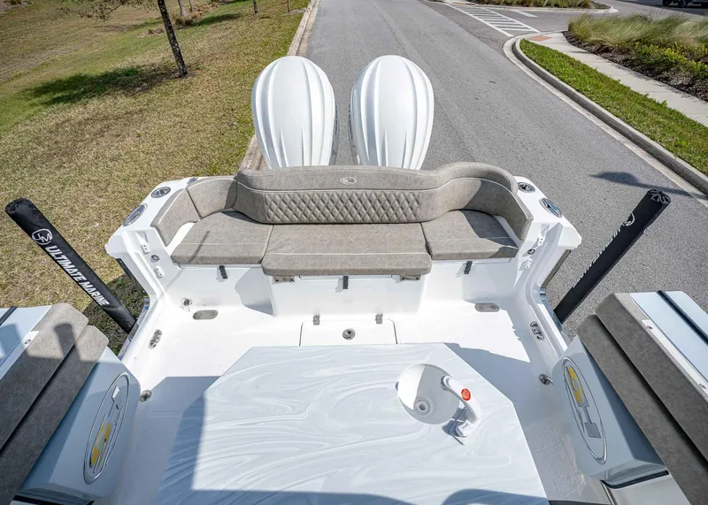 Slide: The Image of 2025 Sea Hunt Ultra 275 SE boat interior with cushioned seating and sleek design. - 11
