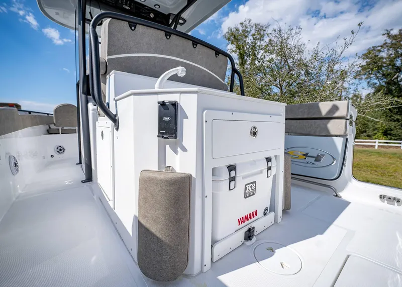 Slide: The Image of 2025 Sea Hunt Ultra 275 SE boat interior with storage and seating. - 14