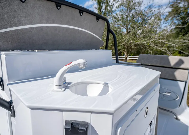 Slide: The Image of Sea Hunt Ultra 275 SE 2025 boat sink and counter detail, outdoor setting. - 15