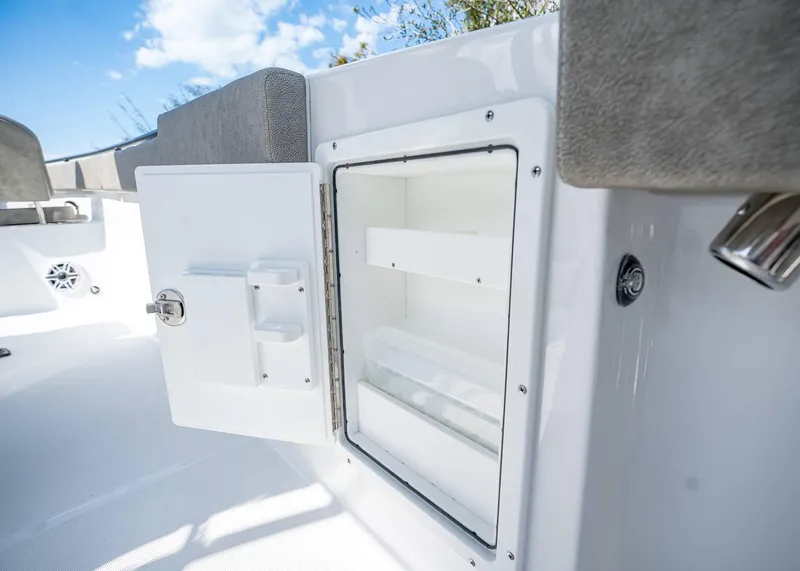 Slide: The Image of Open storage compartment on 2025 Sea Hunt Ultra 275 SE boat, showcasing interior space. - 22