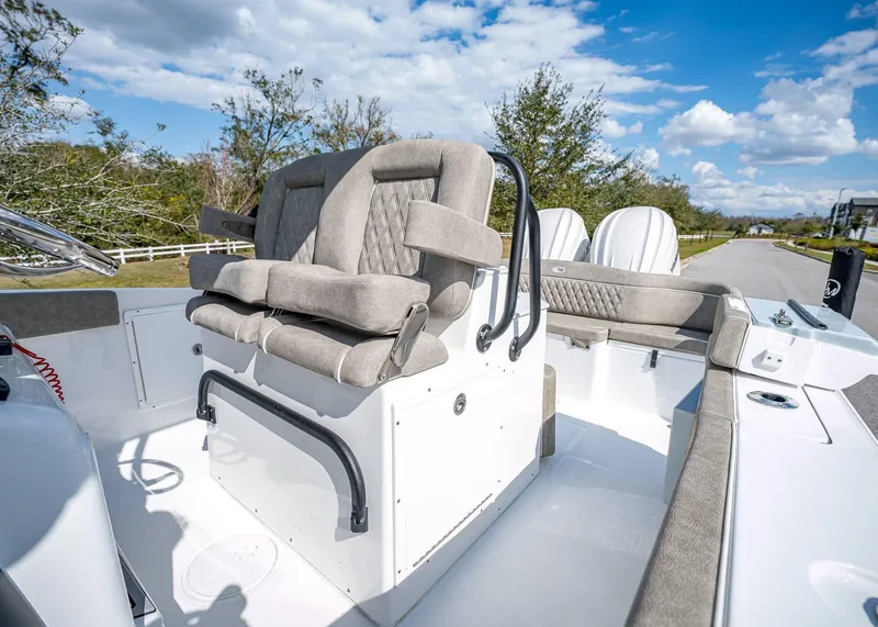 Slide: The Image of 2025 Sea Hunt Ultra 275 SE boat interior with plush seating and modern design. - 23