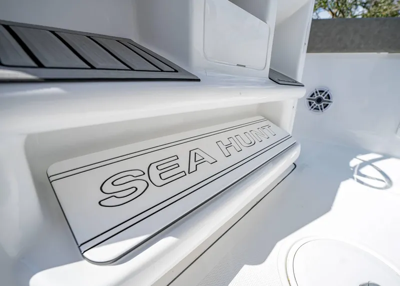 Slide: The Image of 2025 Sea Hunt Ultra 275 SE boat interior detail with logo. - 25