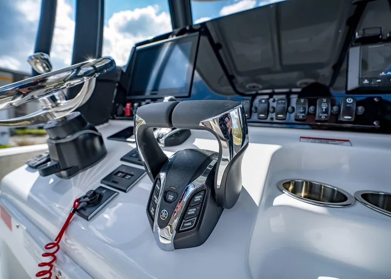Slide: The Image of 2025 Sea Hunt Ultra 275 SE boat dashboard with modern controls and steering wheel. - 27