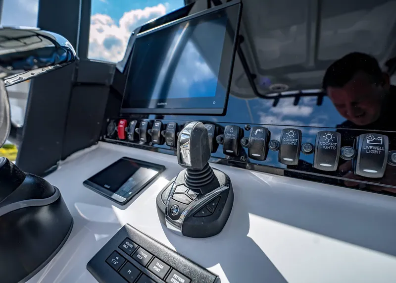 Slide: The Image of Control panel of 2025 Sea Hunt Ultra 275 SE boat with joystick and touchscreen. - 28