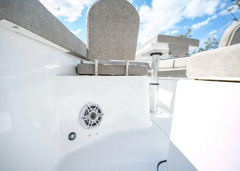 Slide: The Image of 2025 Sea Hunt Ultra 275 SE boat interior with seating and speaker system. - 34