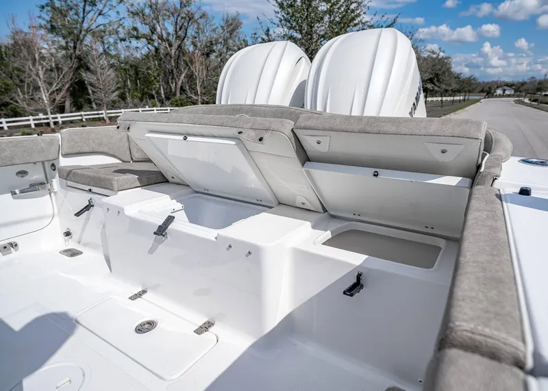 Slide: The Image of 2025 Sea Hunt Ultra 275 SE boat interior with open storage compartments. - 8