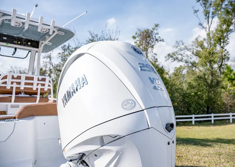 Slide: The Image of 2025 Sea Hunt Ultra 235 SE boat with Yamaha 250 V6 engine, outdoors. - 5