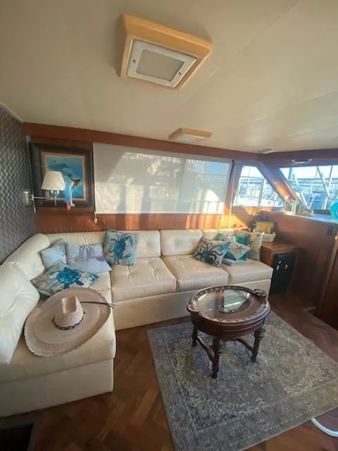 Slide: The Image of Luxurious interior of 1987 Hatteras 40 Double Cabin with plush seating and elegant decor. - 10