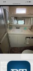 Slide: The Image of Bathroom interior of 1987 Hatteras 40 Double Cabin yacht, featuring sink and shower. - 4