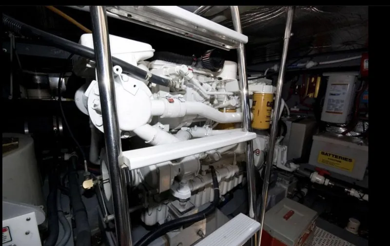 Slide: The Image of Engine room of 1998 Sea Ray 450 Sundancer yacht, showcasing machinery and equipment. - 17
