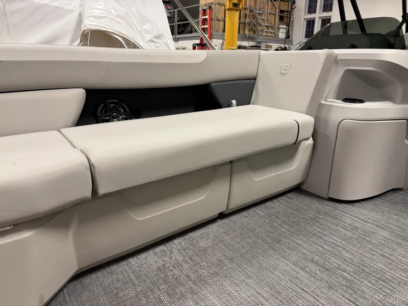 Slide: The Image of 2025 Godfrey Sweetwater Entertainment boat interior with beige seating and modern design. - 11