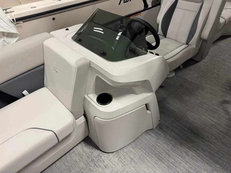 Slide: The Image of 2025 Godfrey Sweetwater Entertainment boat interior with sleek seating and modern console design. - 13