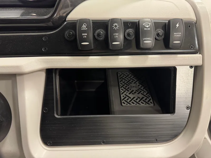 Slide: The Image of Control panel of 2025 Godfrey Sweetwater Entertainment boat with various switches. - 19