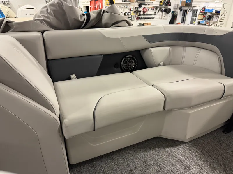 Slide: The Image of 2025 Godfrey Sweetwater Entertainment boat interior with plush seating and integrated speaker system. - 24
