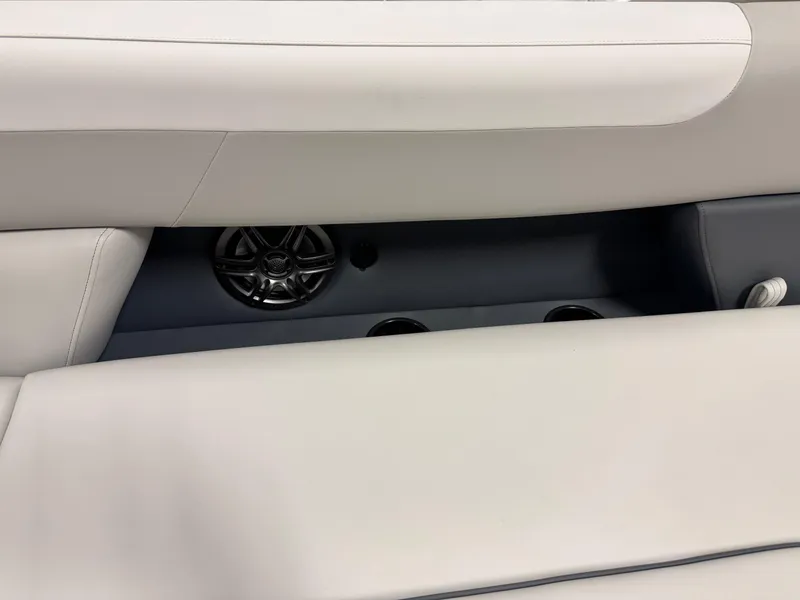 Slide: The Image of Interior of 2025 Godfrey Sweetwater Entertainment boat with speaker and cup holders. - 26