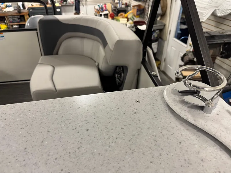Slide: The Image of Interior of 2025 Godfrey Sweetwater Entertainment boat with seating and cup holder. - 29