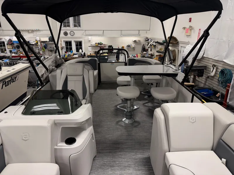 Slide: The Image of Interior of 2025 Godfrey Sweetwater Entertainment boat with seating and table setup. - 6