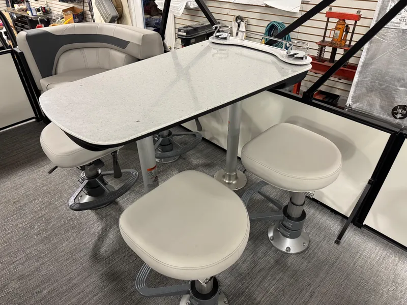 Slide: The Image of 2025 Godfrey Sweetwater Entertainment boat seating with table and swivel chairs. - 9