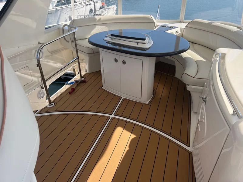 Slide: The Image of Luxurious 2008 Ovation 52 yacht interior with elegant seating and sleek table design. - 15