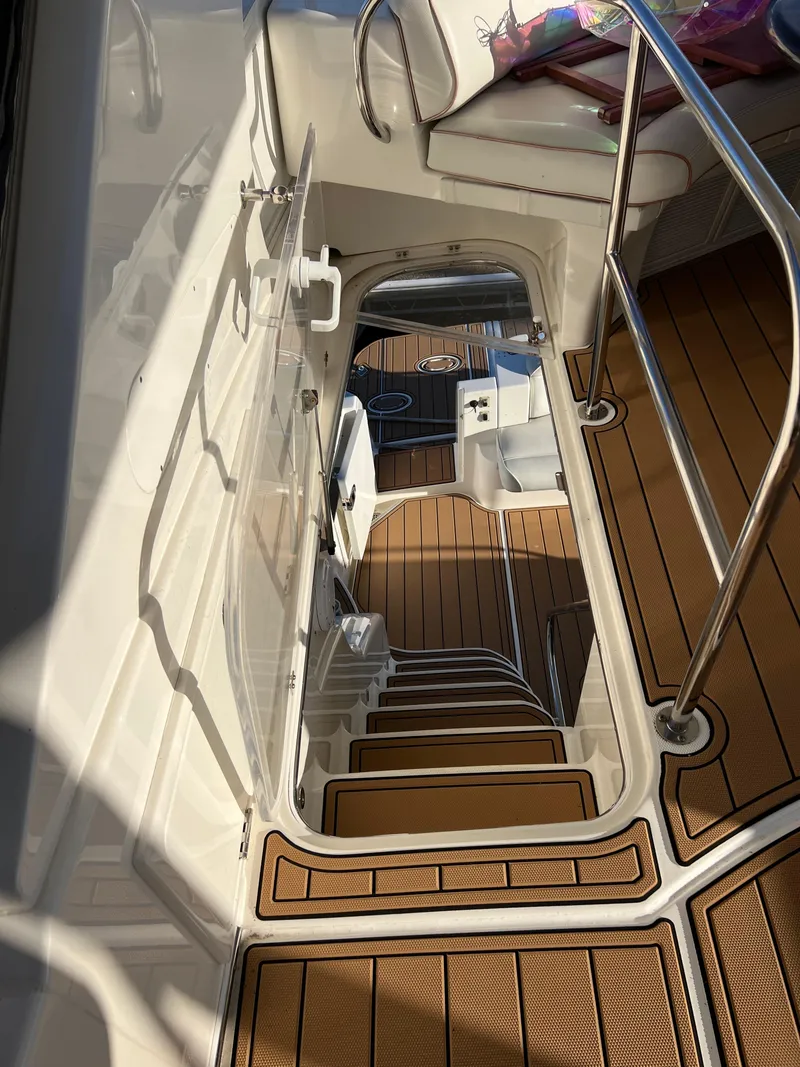Slide: The Image of Staircase on 2008 Ovation 52 yacht with wooden flooring and metal railings. - 22