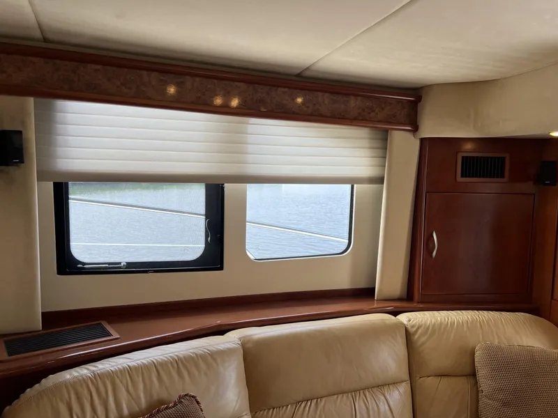Slide: The Image of Interior of a 2008 Ovation 52 yacht with leather seating and wooden cabinetry. - 25