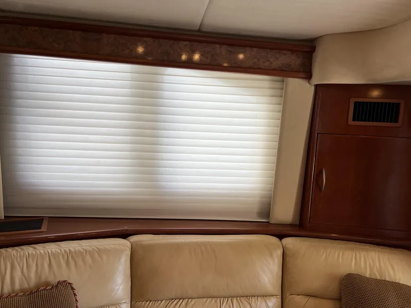 Slide: The Image of Luxurious interior of 2008 Ovation 52 yacht with leather seating and elegant wood paneling. - 28