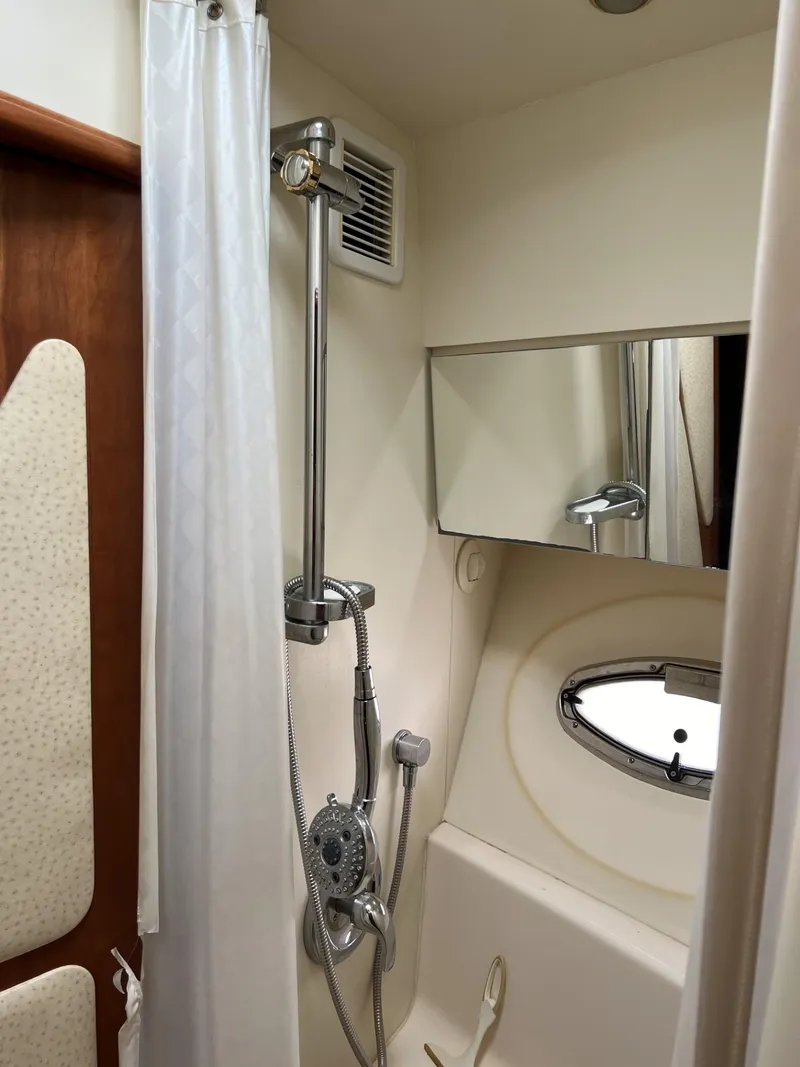 Slide: The Image of 2008 Ovation 52 yacht bathroom with shower, mirror, and porthole window. - 40