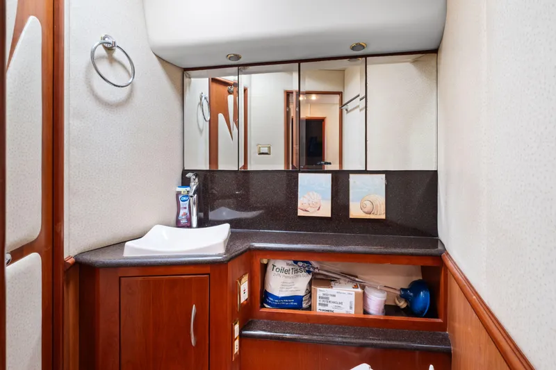 Slide: The Image of Luxurious bathroom in 2008 Ovation 52 yacht with modern fixtures and wooden cabinetry. - 45