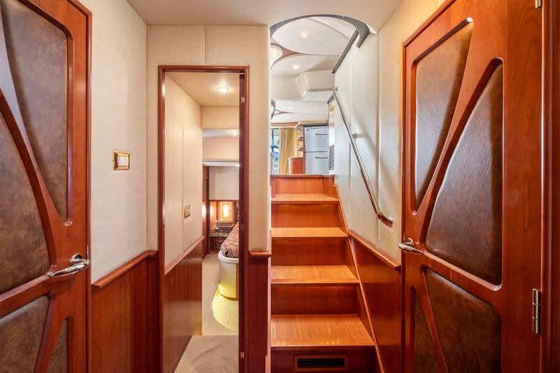 Slide: The Image of Interior of 2008 Ovation 52 yacht with wooden stairs and elegant cabin doors. - 49