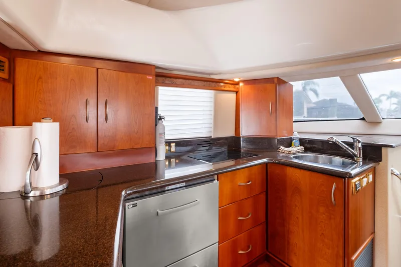 Slide: The Image of Luxurious kitchen interior of 2008 Ovation 52 yacht with wooden cabinets and modern appliances. - 50