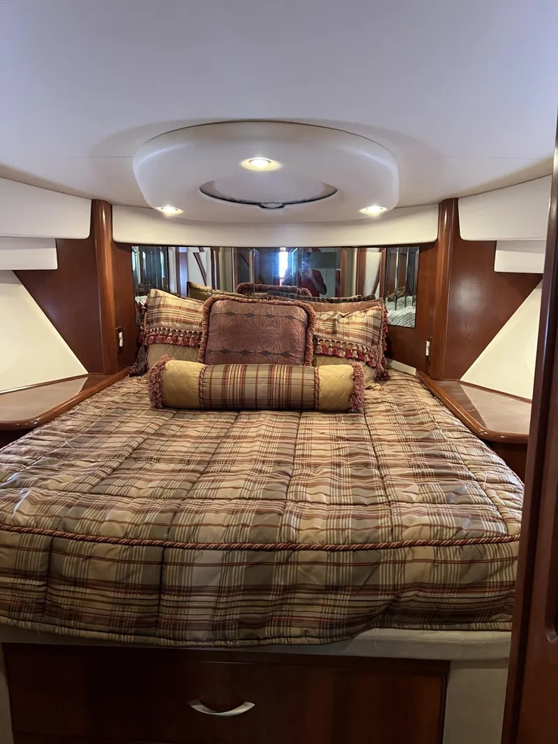 Slide: The Image of Luxurious bedroom interior of a 2008 Ovation 52 yacht with elegant bedding. - 52