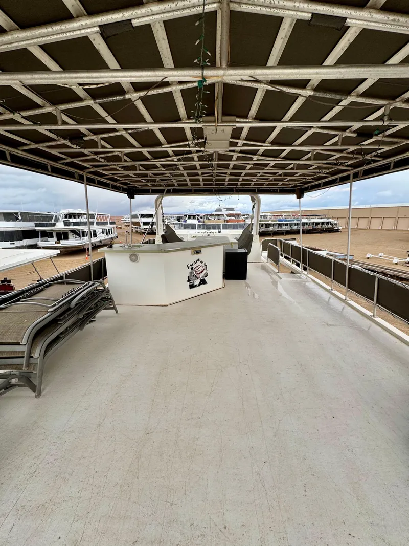 Slide: The Image of Spacious upper deck of 2000 Fantasy Escape From LA houseboat with covered seating area. - 21