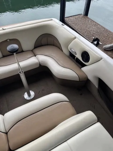 Slide: The Image of 2005 Malibu Sunsetter 23 XTi boat interior with beige and brown seating. - 11