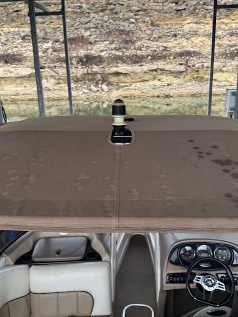 Slide: The Image of 2005 Malibu Sunsetter 23 XTi boat interior with dashboard and seating. - 14