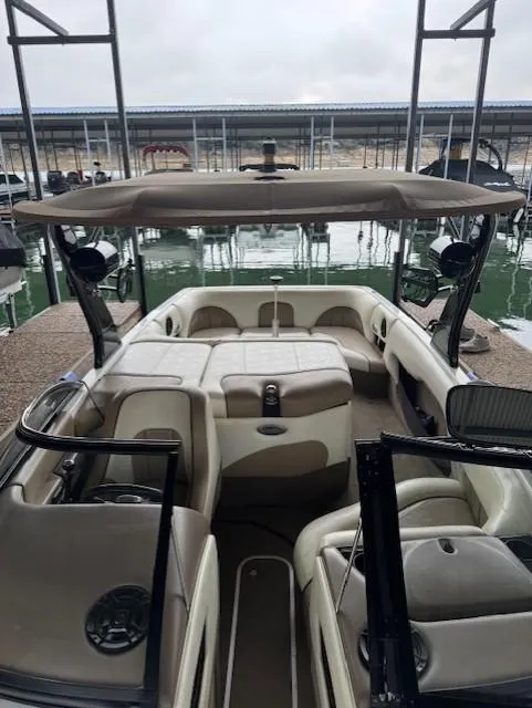 Slide: The Image of 2005 Malibu Sunsetter 23 XTi boat interior at a marina dock. - 3