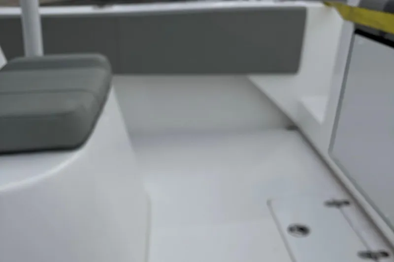 Slide: The Image of Interior view of 2025 Cape Horn 28 XS boat with gray seating. - 10